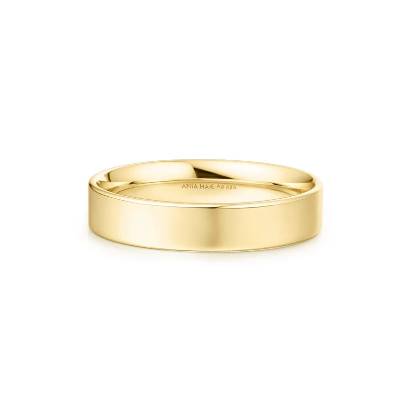 Gold ring on a white background