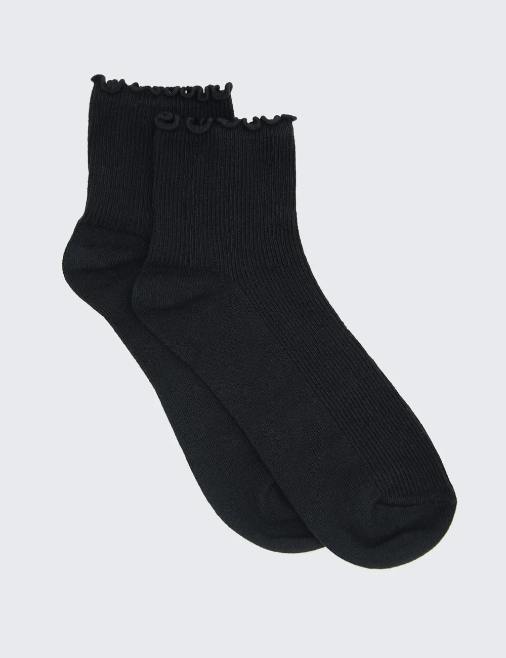 A black crew sock with ribbed texture and a lettuce edge design.