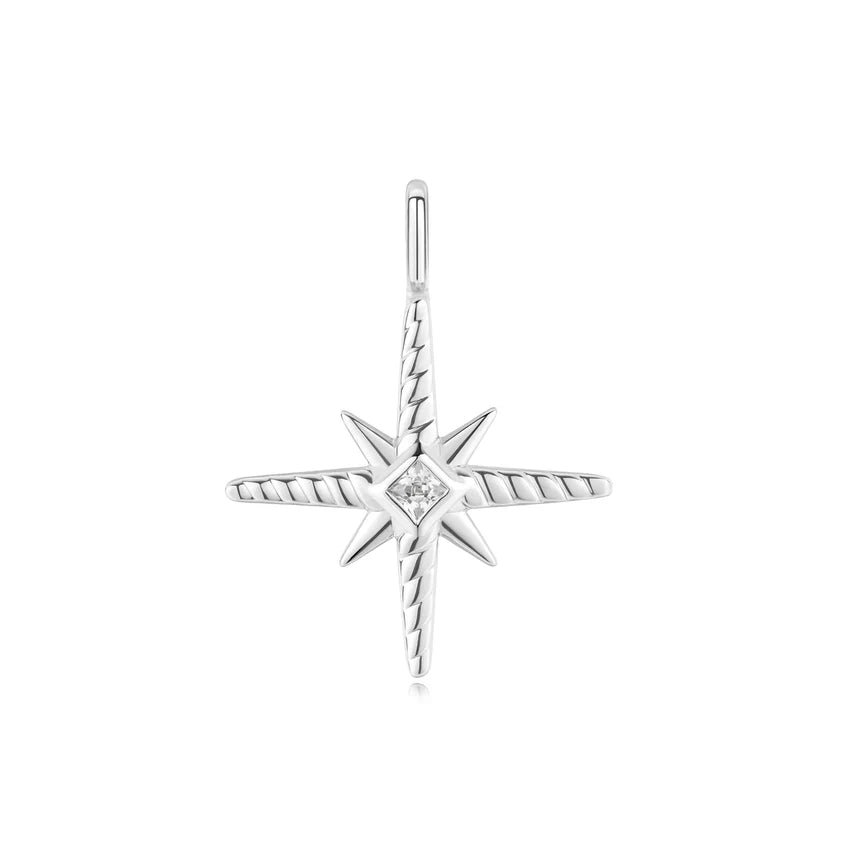 Silver star-shaped pendant with a central gemstone on a white background